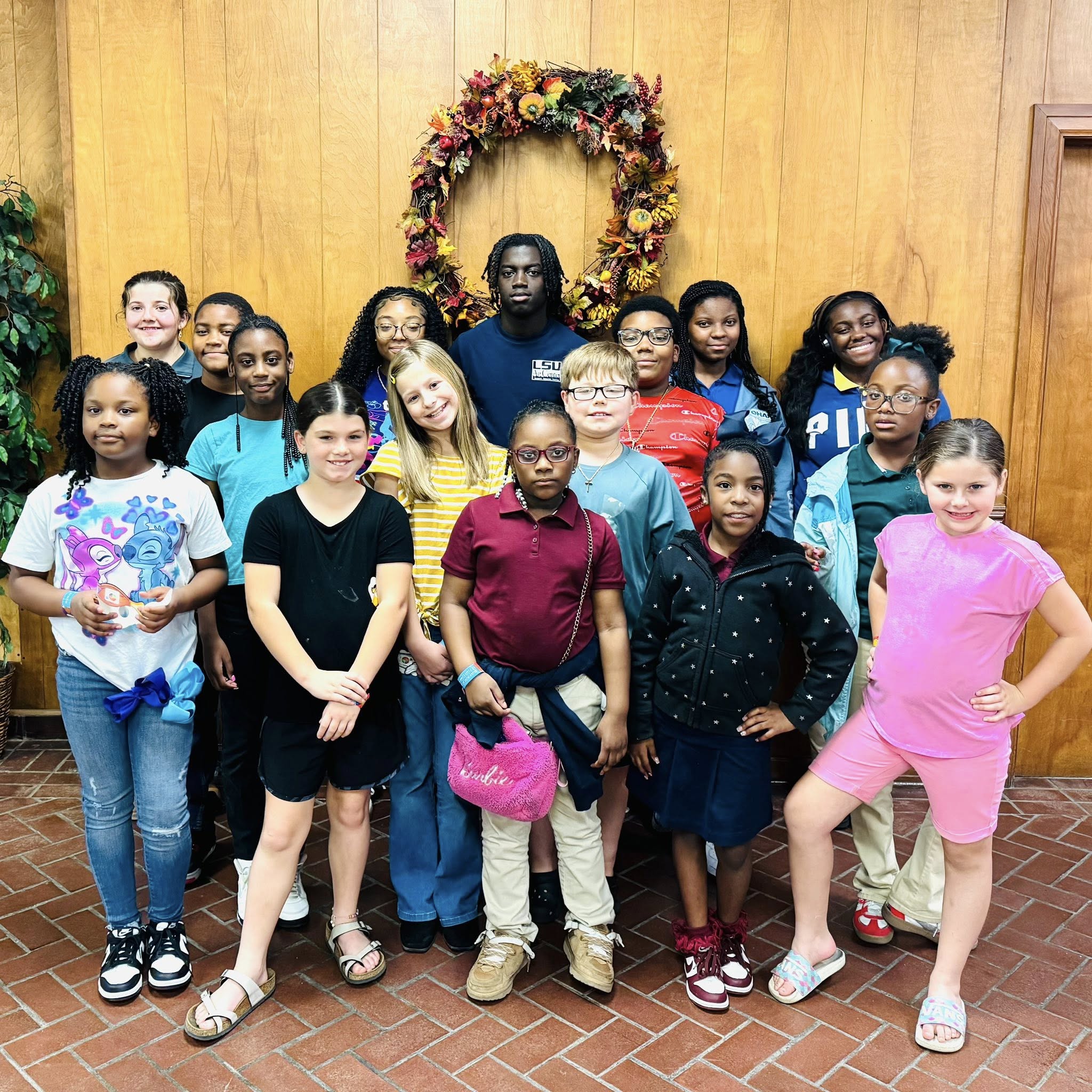A group of kids posing for a photo.